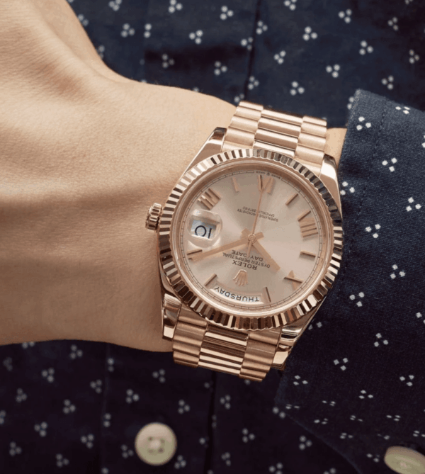 Day-date rose gold sundust roman dial 40mm